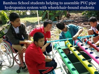 Bamboo School students helping to assemble PVC pipe
hydroponics system with wheelchair-bound students
 