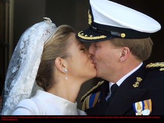 Dutch Crown Prince Willem-Alexander kisses his wife Princess Maxima as they wave to the crowd from the balcony of the Roya...