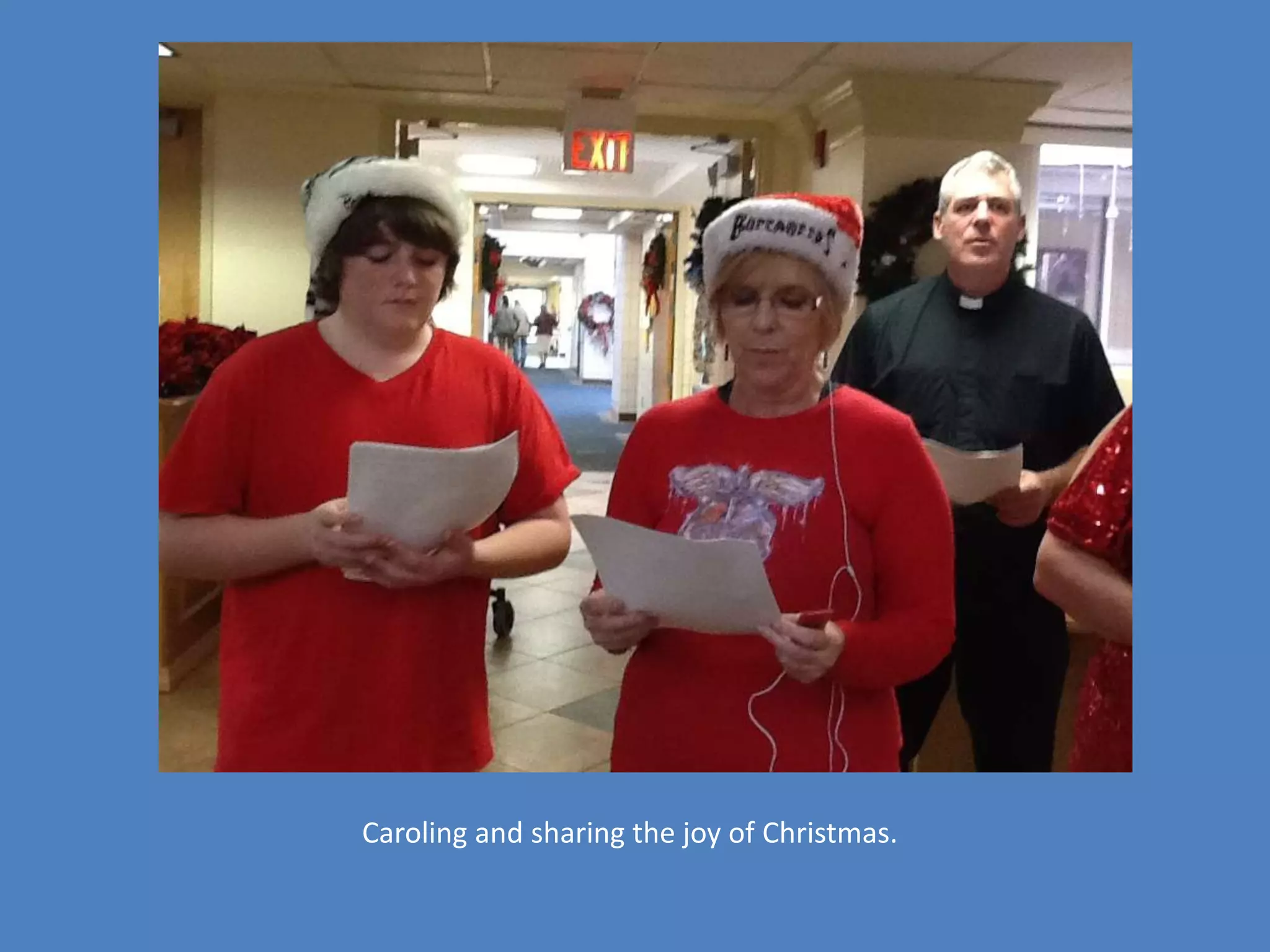 Caroling and sharing the joy of Christmas.
 