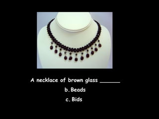 A necklace of brown glass ______ Beads Bids  