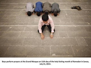 Boys perform prayers at the Grand Mosque on 11th day of the holy fasting month of Ramadan in Sanaa,
July 21, 2013.
 