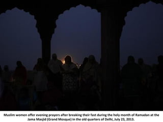 Muslim women offer evening prayers after breaking their fast during the holy month of Ramadan at the
Jama Masjid (Grand Mo...