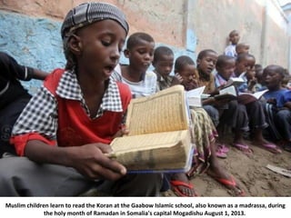 Muslim children learn to read the Koran at the Gaabow Islamic school, also known as a madrassa, during
the holy month of R...