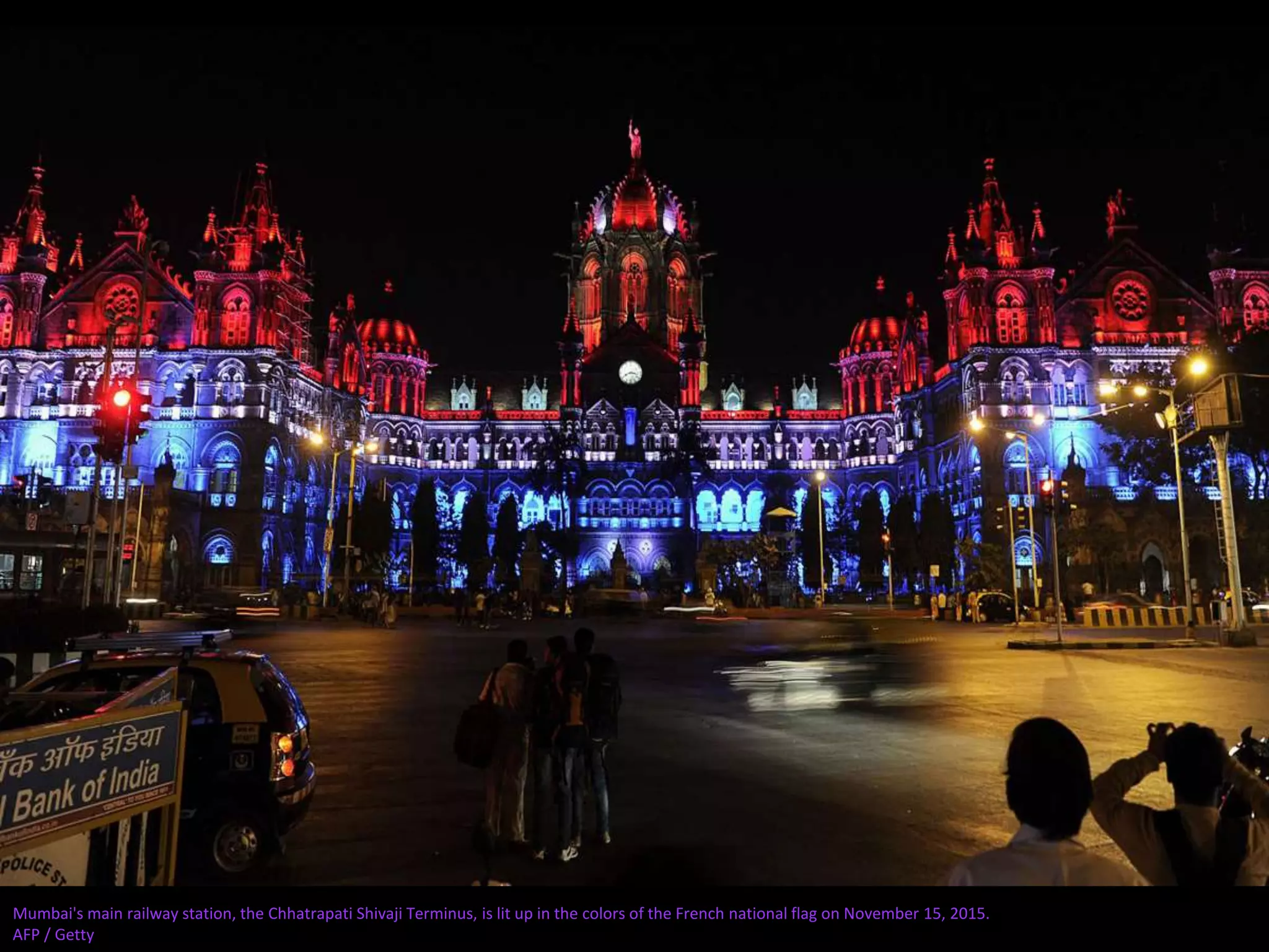 Mumbai's main railway station, the Chhatrapati Shivaji Terminus, is lit up in the colors of the French national flag on November 15, 2015.
AFP / Getty
 