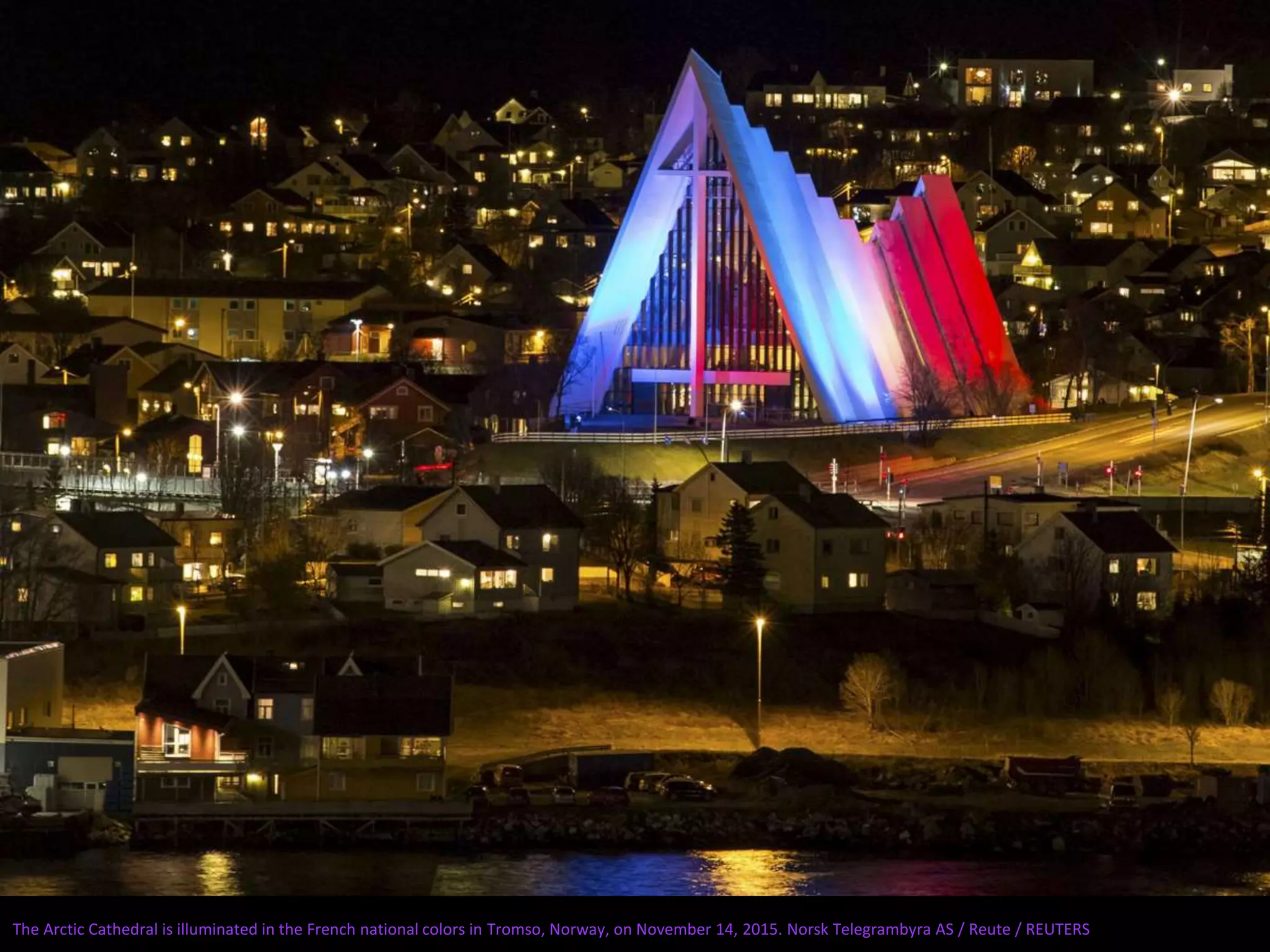 The Arctic Cathedral is illuminated in the French national colors in Tromso, Norway, on November 14, 2015. Norsk Telegrambyra AS / Reute / REUTERS
 