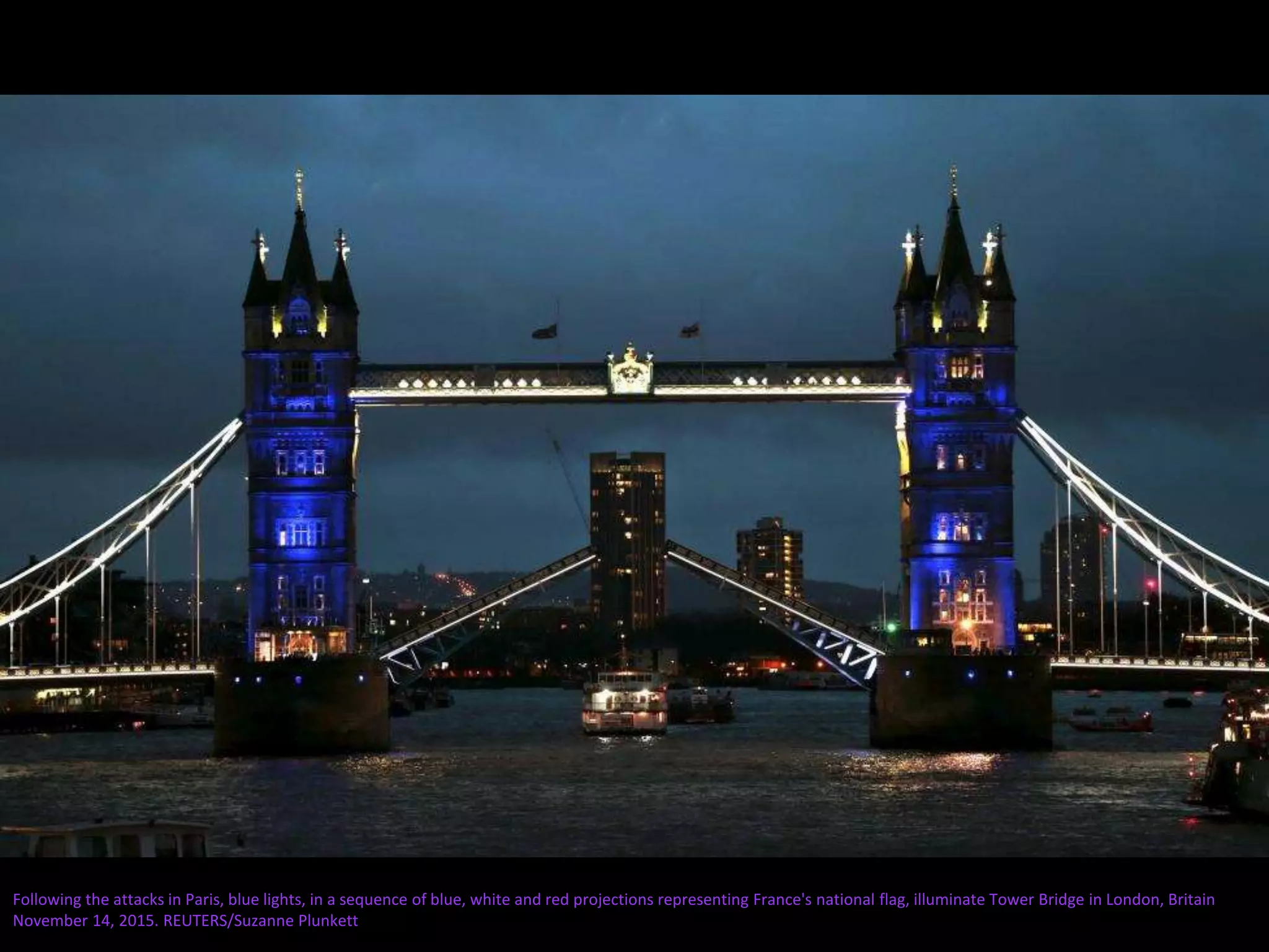 Following the attacks in Paris, blue lights, in a sequence of blue, white and red projections representing France's national flag, illuminate Tower Bridge in London, Britain
November 14, 2015. REUTERS/Suzanne Plunkett
 