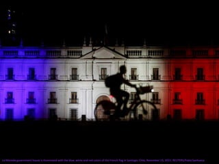 La Moneda government house is illuminated with the blue, white and red colors of the French flag in Santiago, Chile, November 15, 2015. REUTERS/Pablo Sanhueza
 