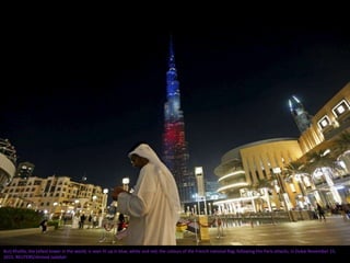 Burj Khalifa, the tallest tower in the world, is seen lit up in blue, white and red, the colours of the French national fl...