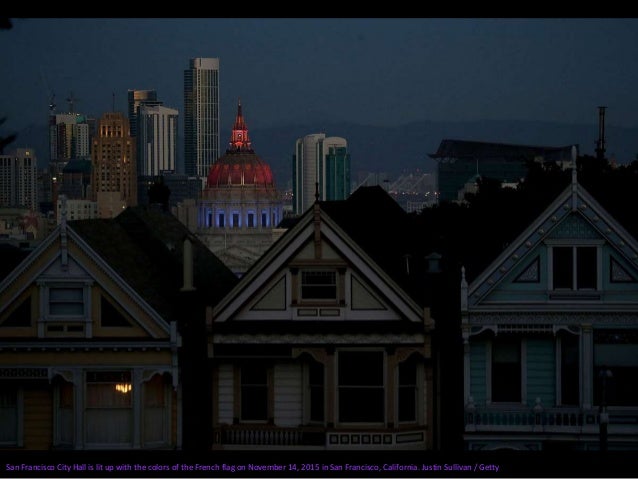 The Washington Arch in Washington Square Park is lit up in blue, white and red, the colors of the French flag, in New York...