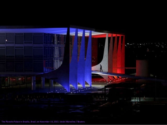 Mumbai's main railway station, the Chhatrapati Shivaji Terminus, is lit up in the colors of the French national flag on No...