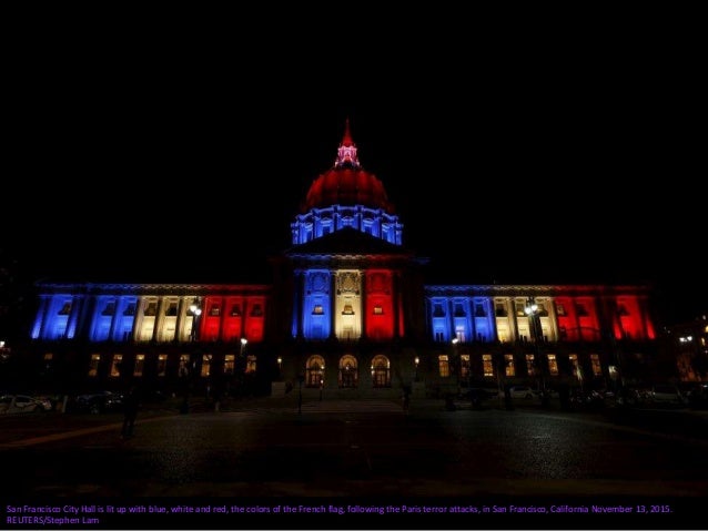 Colors of the French national flag are projected onto the Jet d'Eau fountain in Geneva on November 15, 2015, in memory of ...