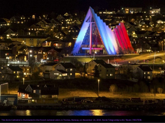 The Angel de la Independencia monument is lit up in blue, white and red, the colors of the French flag, following the Pari...