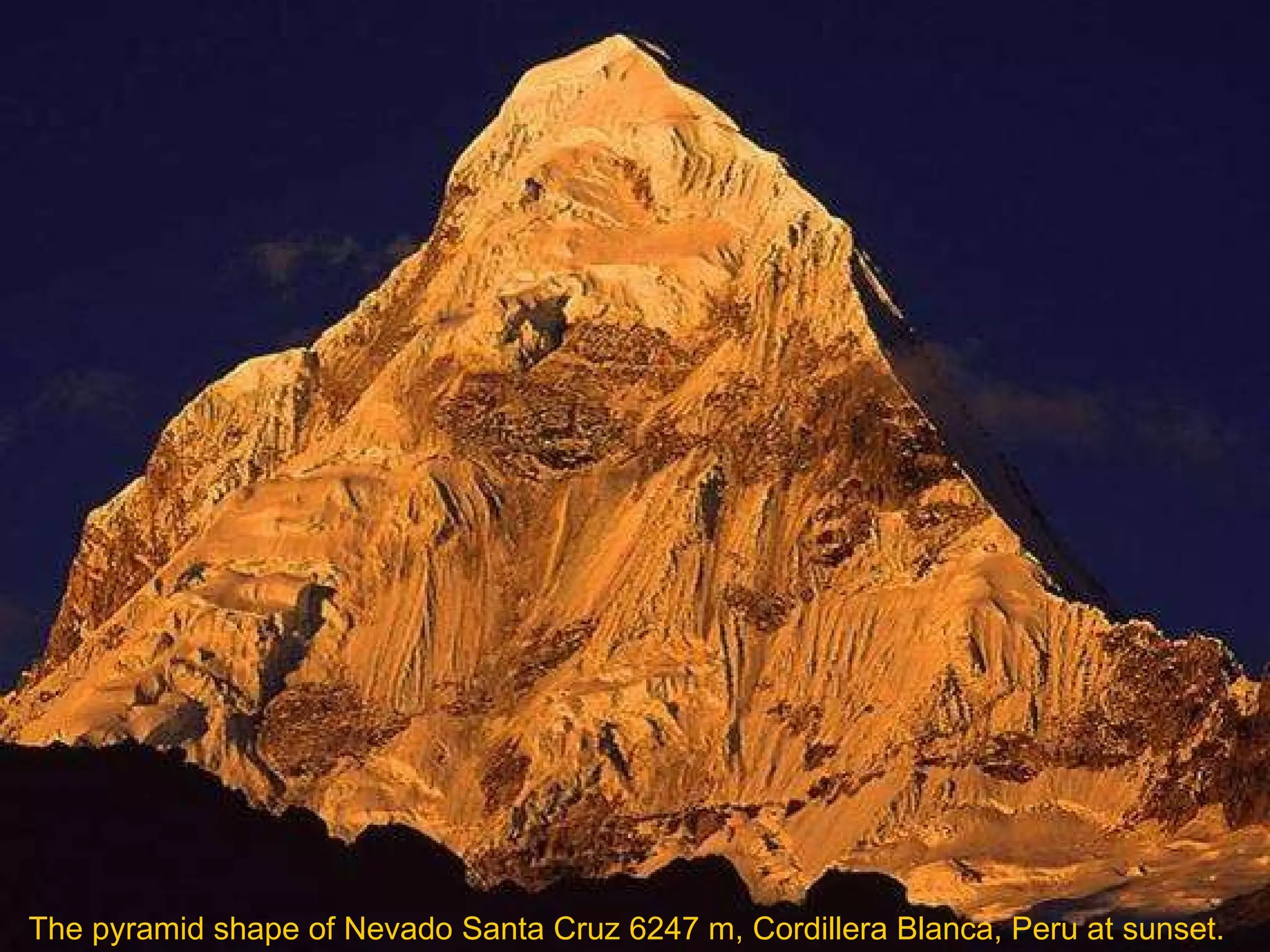 The pyramid shape of Nevado Santa Cruz 6247 m, Cordillera Blanca, Peru at sunset.  