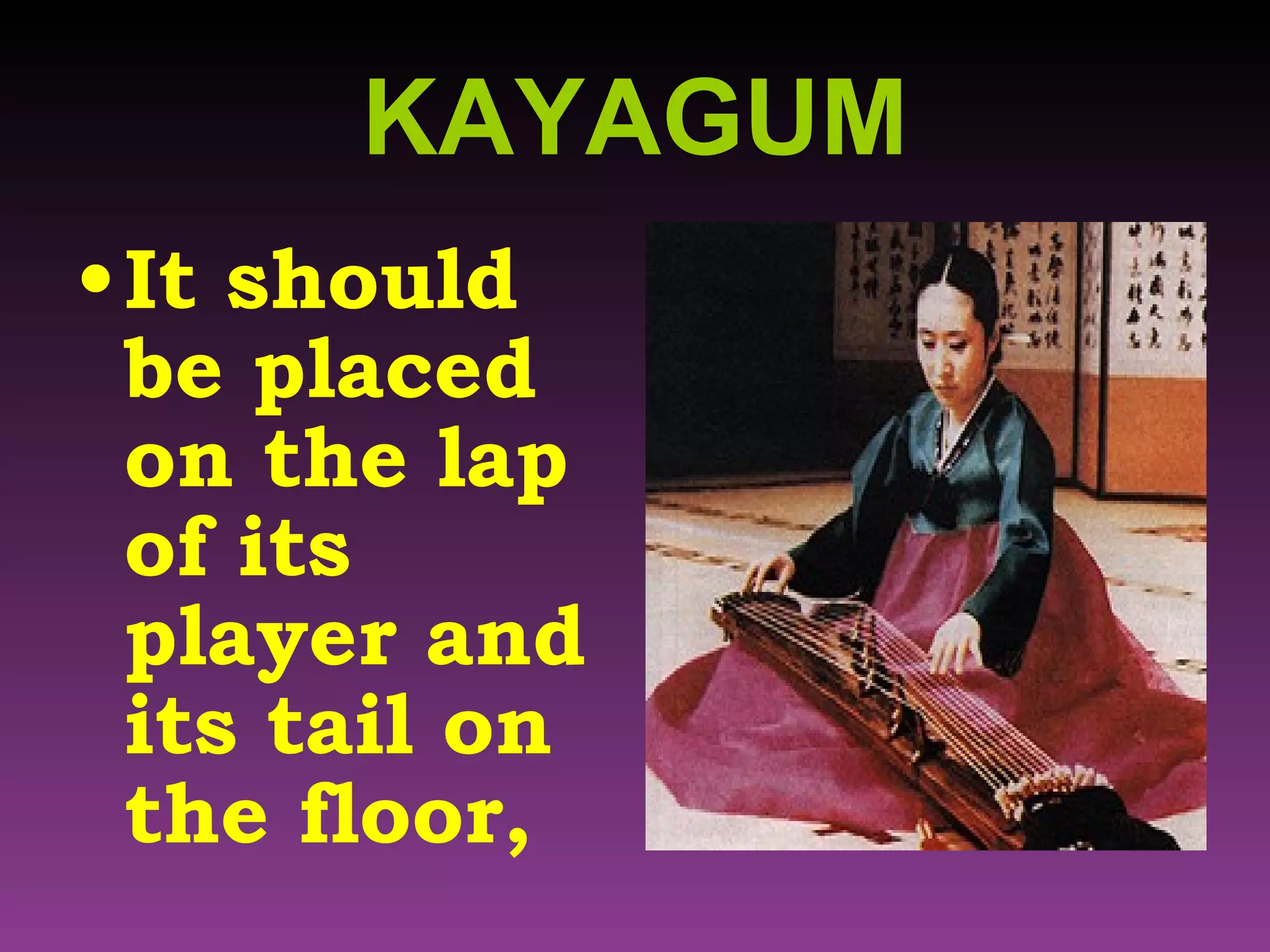 KAYAGUM It should be placed on the lap of its player and its tail on the floor, 