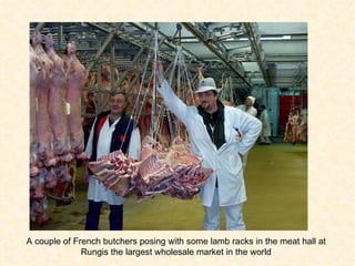 A couple of French butchers posing with some lamb racks in the meat hall at Rungis the largest wholesale market in the world 