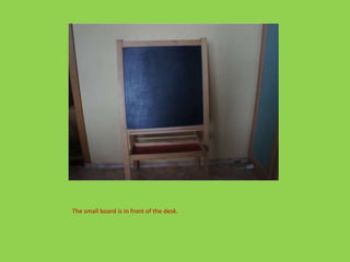 The small board is in front of the desk.
 
