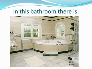 In this bathroom there is:
One
bathtub
A white
sink
One
shower
One
toilet
 
