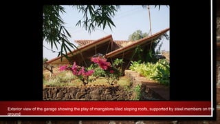 Exterior view of the garage showing the play of mangalore-tiled sloping roofs, supported by steel members on the
ground
 