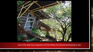 view of the steel truss-supported roof that follows the terraced landscaping on site
 