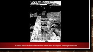 Exterior detail of terracotta-clad roof corner with rectangular openings in the roof
 