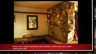 Interior view: leather-upholstered seat cushions, a stone wall, and a mirror
reflecting the wall
 