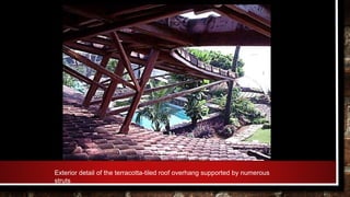Exterior detail of the terracotta-tiled roof overhang supported by numerous
struts
 
