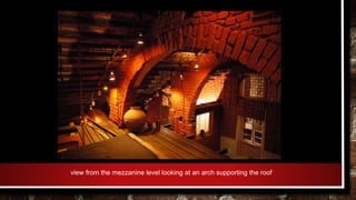 view from the mezzanine level looking at an arch supporting the roof
 