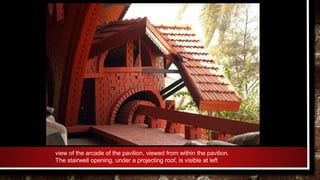view of the arcade of the pavilion, viewed from within the pavilion.
The stairwell opening, under a projecting roof, is visible at left
 