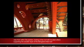 view from within the pavilion, looking at the roof with its steel rafters
supporting the wooden layer of the Mangalore-tiled roof
 