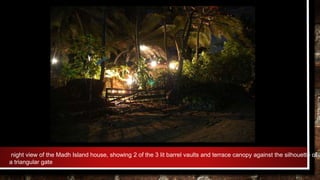 night view of the Madh Island house, showing 2 of the 3 lit barrel vaults and terrace canopy against the silhouette of
a triangular gate
 