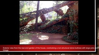 Exterior view from the rear-end garden of the house, overlooking a non-structural stone buttress with large pots and
foliage
 
