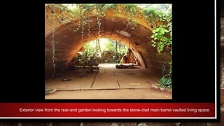 Exterior view from the rear-end garden looking towards the stone-clad main barrel vaulted living space
 