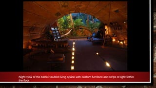 Night view of the barrel vaulted living space with custom furniture and strips of light within
the floor
 