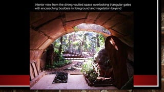 Interior view from the dining vaulted space overlooking triangular gates
with encroaching boulders in foreground and vegetation beyond
 
