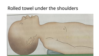 Rolled towel under the shoulders
 