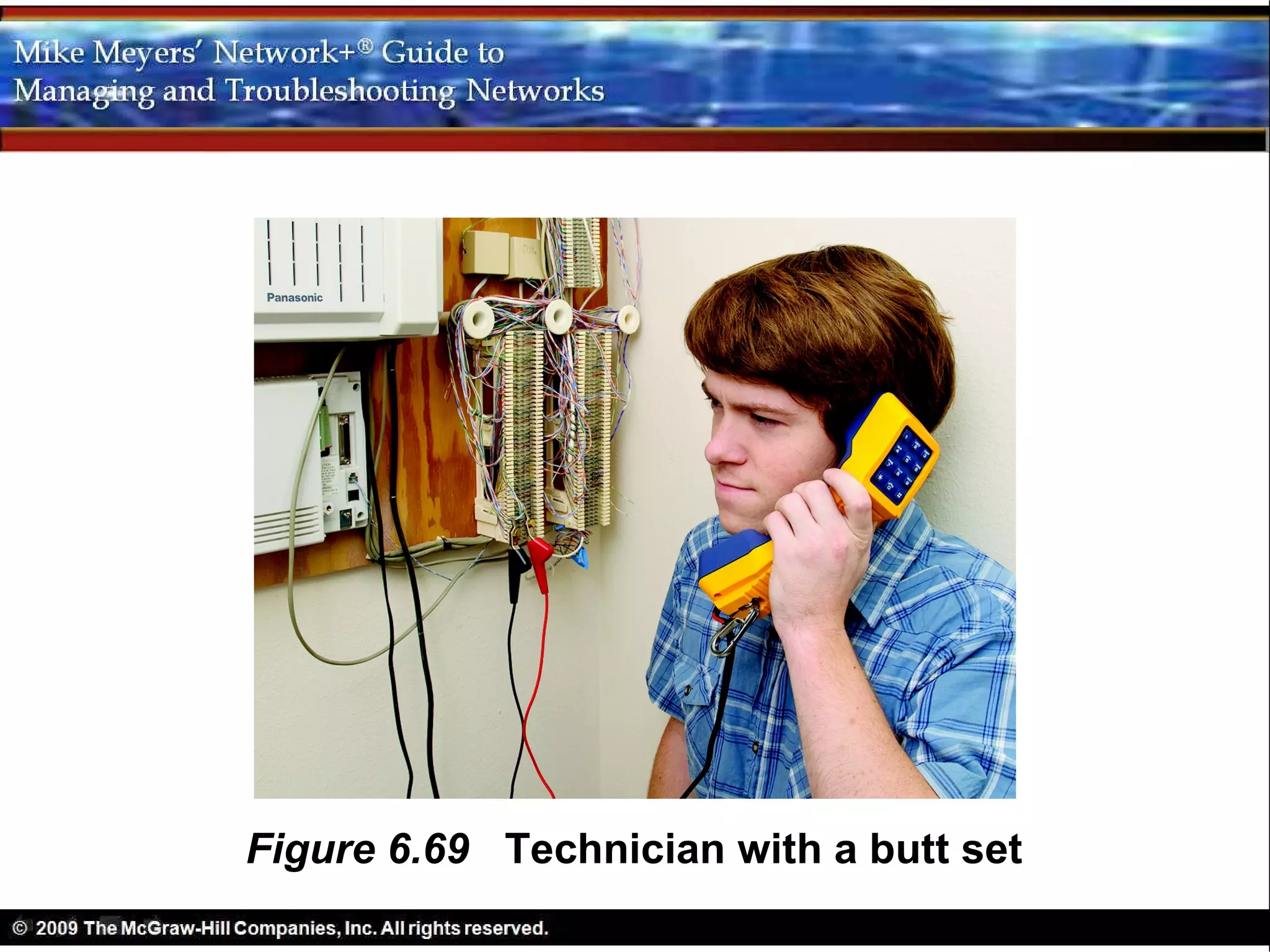 Figure 6.69 Technician with a butt set
 
