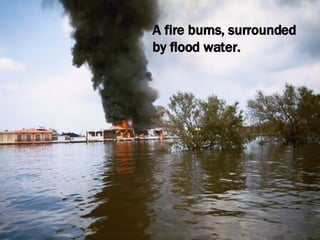 A fire burns, surrounded by flood water. 