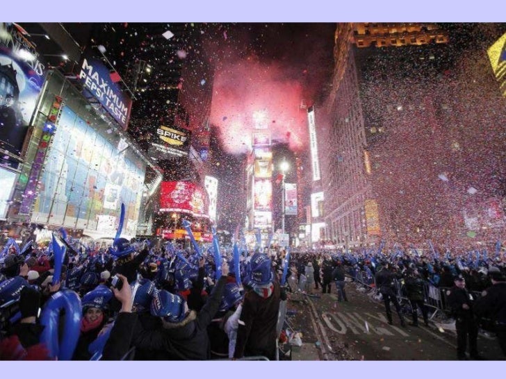 revelers cheer confetti falls and revelers cheer confetti falls and