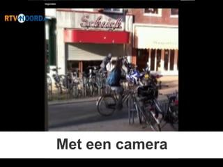Met een camera
 