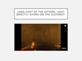 LONG SHOT OF THE SETTING, LIGHT
DIRECTLY SHONE ON THE GUITARIST.
 