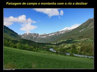 Paisagem de campo e montanha com o rio a deslizar
 