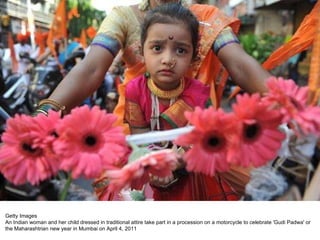 Getty Images An Indian woman and her child dressed in traditional attire take part in a procession on a motorcycle to celebrate 'Gudi Padwa' or the Maharashtrian new year in Mumbai on April 4, 2011 