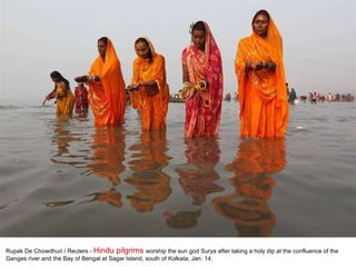 Rupak De Chowdhuri / Reuters -  Hindu pilgrims  worship the sun god Surya after taking a holy dip at the confluence of the Ganges river and the Bay of Bengal at Sagar Island, south of Kolkata, Jan. 14.  