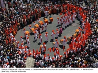 Rajanish Kakade / AP - People dressed in traditional attire dance during a procession to mark "Gudi Padwa," or Maharashtrian New Year, in Mumbai on Monday. 