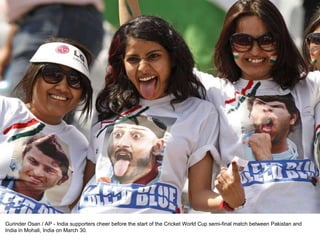Gurinder Osan / AP - India supporters cheer before the start of the Cricket World Cup semi-final match between Pakistan and India in Mohali, India on March 30. 