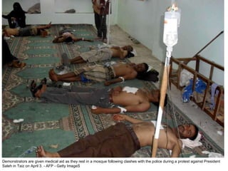 Demonstrators are given medical aid as they rest in a mosque following clashes with the police during a protest against President Saleh in Taiz on April 3. - AFP - Getty ImageS 