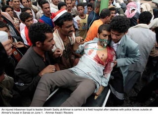 An injured tribesman loyal to leader Shiekh Sadiq al-Ahmar is carried to a field hospital after clashes with police forces outside al-Ahmar's house in Sanaa on June 1.  -Ammar Awad / Reuters  
