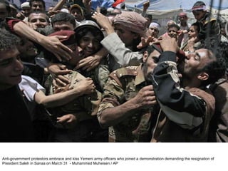 Anti-government protestors embrace and kiss Yemeni army officers who joined a demonstration demanding the resignation of President Saleh in Sanaa on March 31  - Muhammed Muheisen / AP  