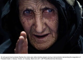 An anti-government protestor flashes the victory sign while chanting slogans during a demonstration demanding the resignation of President Saleh, in Sanaa, Yemen, on Tuesday, March 29, 2011. (AP Photo/Muhammed Muheisen)  