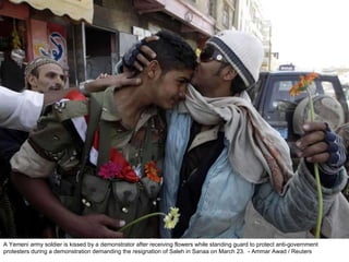 A Yemeni army soldier is kissed by a demonstrator after receiving flowers while standing guard to protect anti-government protesters during a demonstration demanding the resignation of Saleh in Sanaa on March 23.  - Ammar Awad / Reuters  